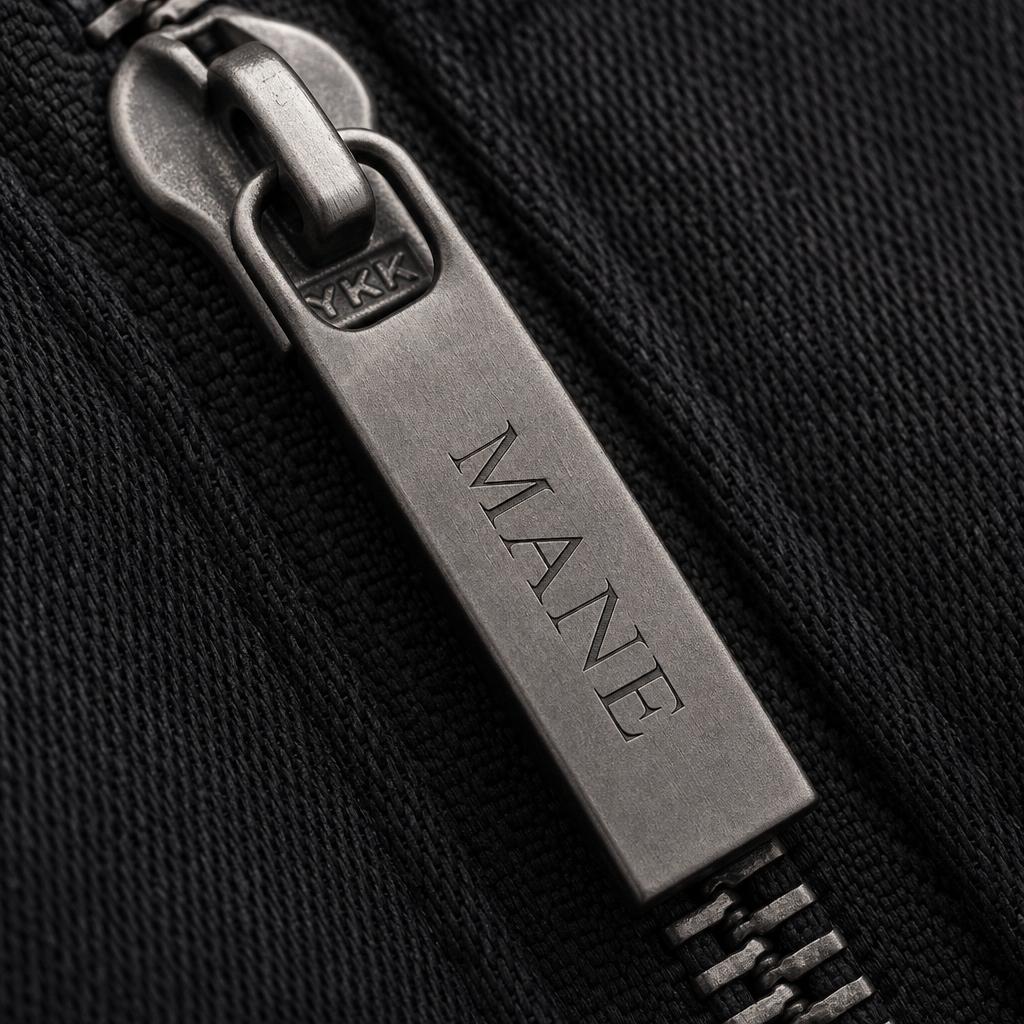 Custom engraved MANE zipper pull detail
