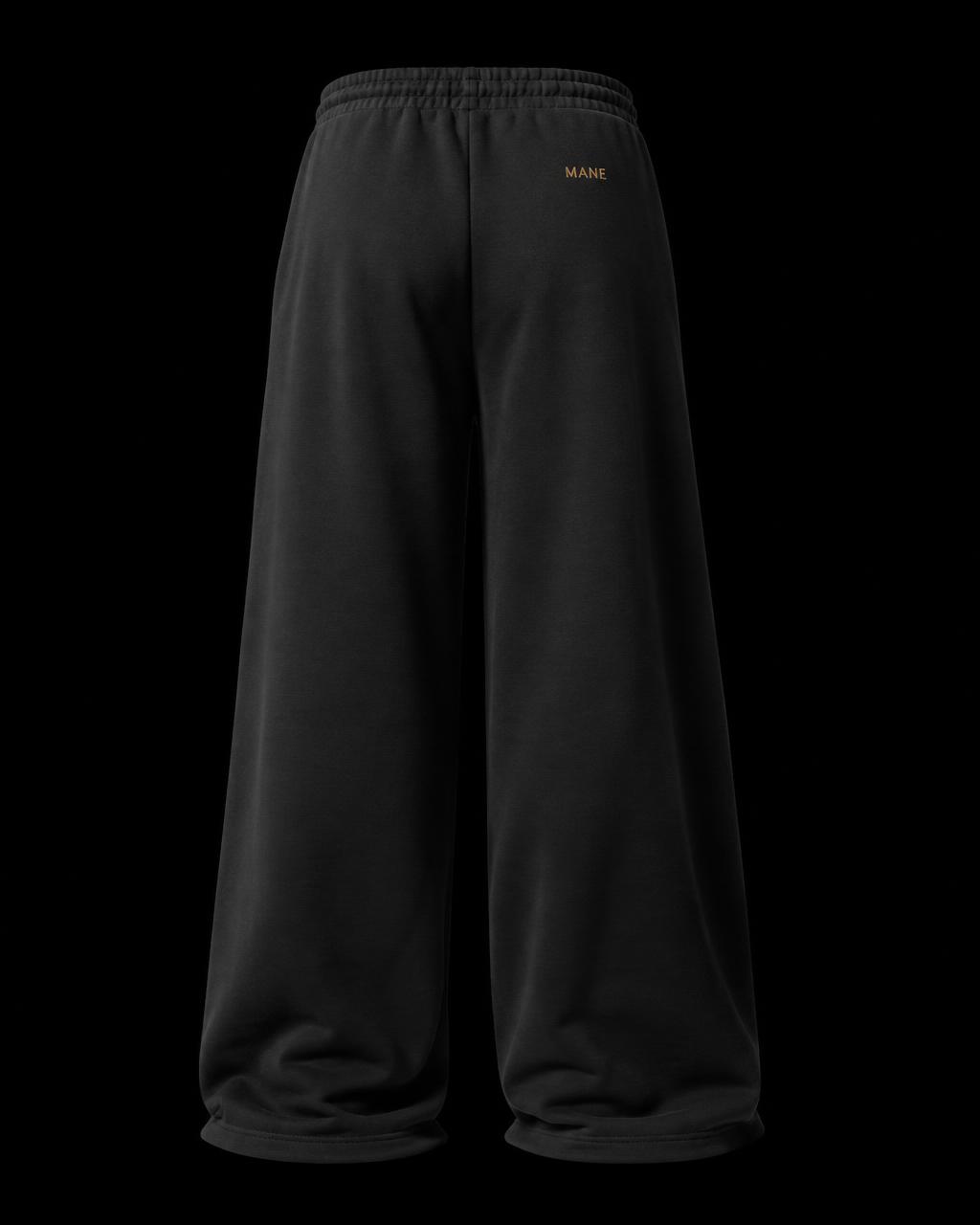 Back view of MANE open-leg baggy sweatpants