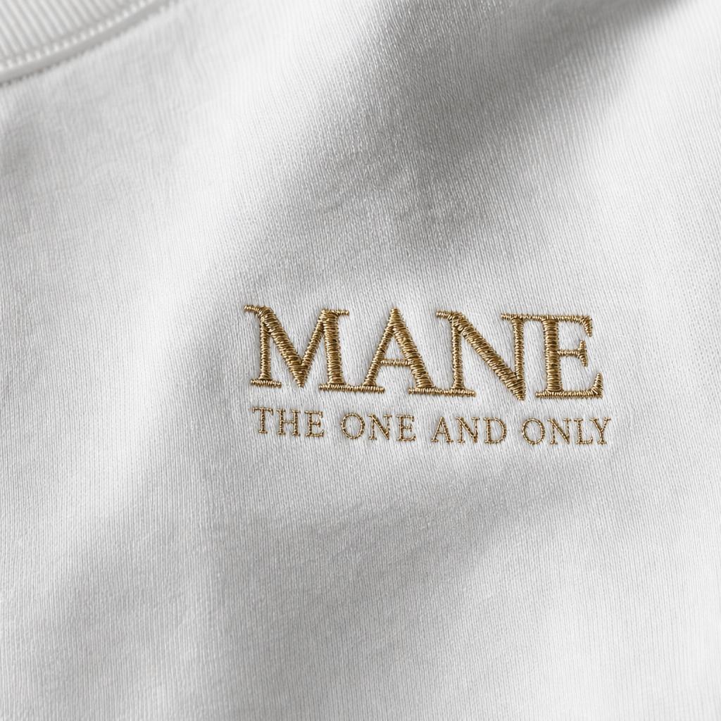 Gold MANE chest logo detail